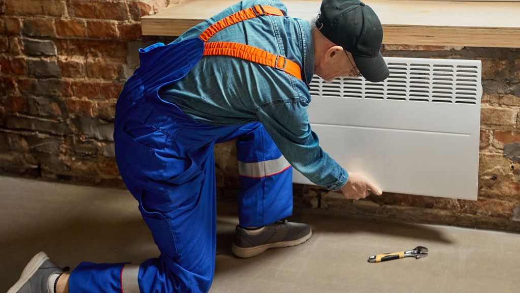 Radiateur électrique à inertie avec programmateur digital dans atelier professionnel